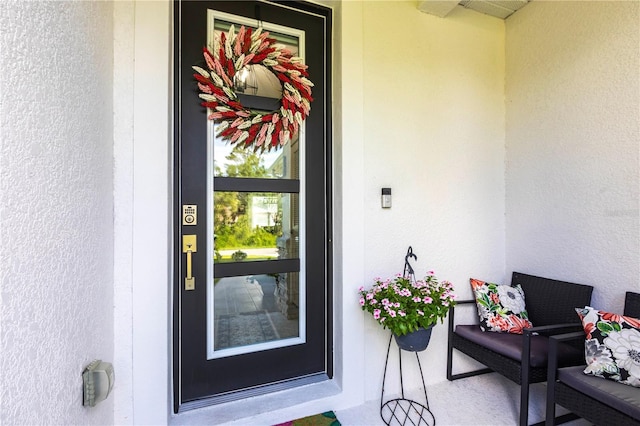 4033 Union Ln, North Port, FL 34288 - property entrance with stucco siding and a porch