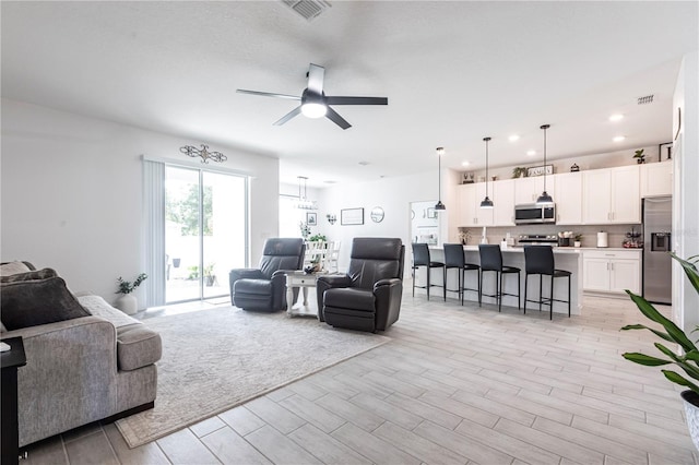 4033 Union Ln, North Port, FL 34288 - living area with ceiling fan, wood finish floors, and recessed lighting