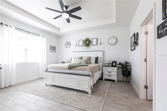 4033 Union Ln, North Port, FL 34288 - bedroom featuring a tray ceiling and a ceiling fan