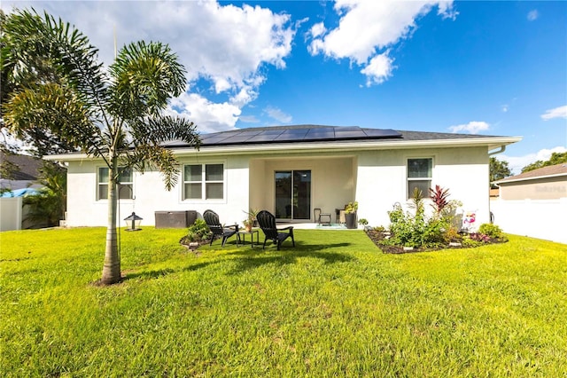 4033 Union Ln, North Port, FL 34288 - back of house featuring stucco siding and roof mounted solar panels