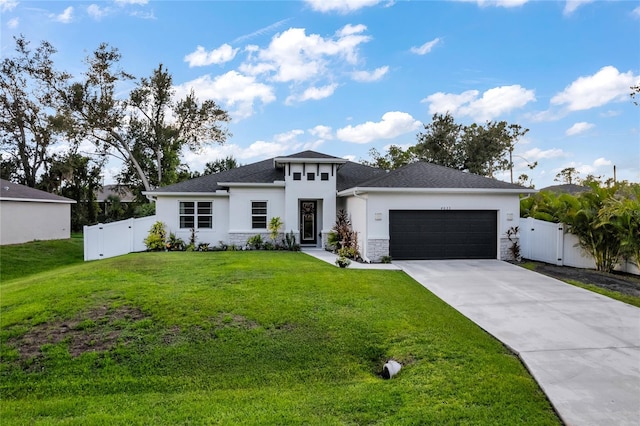 4033 Union Ln, North Port, FL 34288 - prairie-style house with a gate, stucco siding, a garage, and concrete driveway