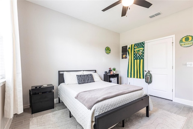 4033 Union Ln, North Port, FL 34288 - bedroom with wood tiled floors and ceiling fan