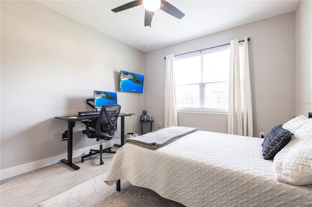 4033 Union Ln, North Port, FL 34288 - bedroom with light wood-style flooring, ceiling fan, and a desk