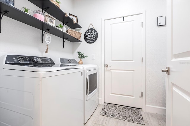 4033 Union Ln, North Port, FL 34288 - laundry area with separate washer and dryer and baseboards