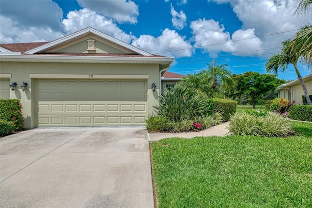 371 Capulet Dr, Venice, FL 34292 - single story home featuring stucco siding, concrete driveway, an attached garage, and a front lawn