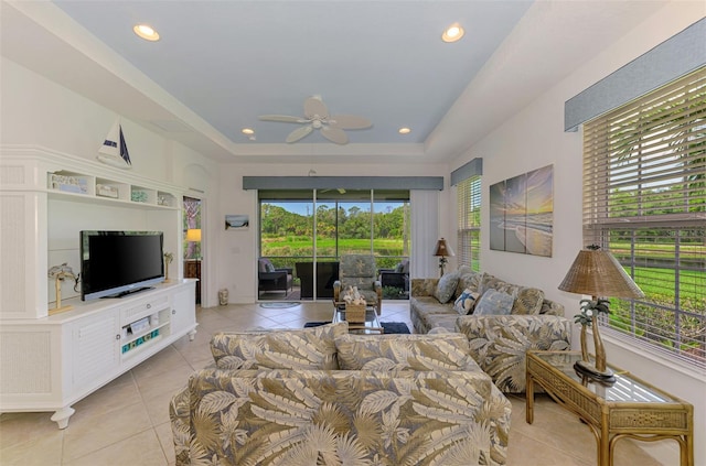 371 Capulet Dr, Venice, FL 34292 - living area with light tile patterned floors, ceiling fan, a raised ceiling, and recessed lighting