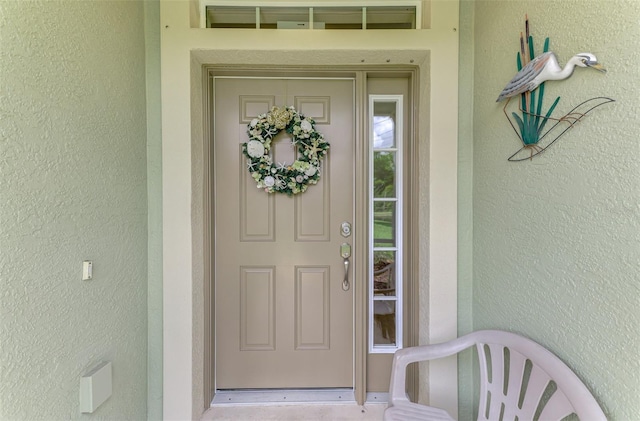 371 Capulet Dr, Venice, FL 34292 - view of exterior entry with stucco siding