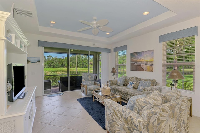 371 Capulet Dr, Venice, FL 34292 - living room with a tray ceiling, a ceiling fan, light tile patterned floors, and recessed lighting