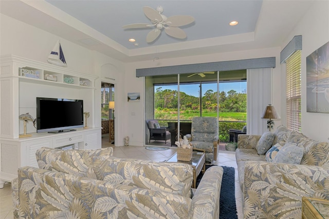 371 Capulet Dr, Venice, FL 34292 - living room featuring light tile patterned flooring, a ceiling fan, a tray ceiling, and recessed lighting