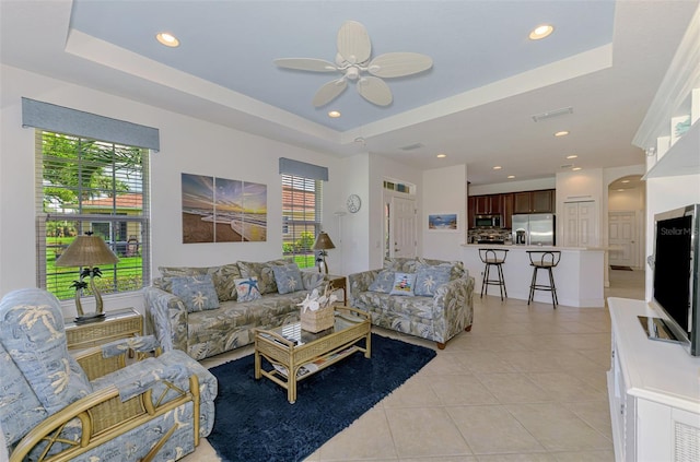 371 Capulet Dr, Venice, FL 34292 - living room featuring light tile patterned flooring, a tray ceiling, ceiling fan, and recessed lighting