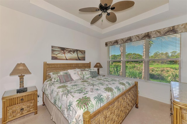 371 Capulet Dr, Venice, FL 34292 - bedroom featuring carpet, a raised ceiling, and ceiling fan