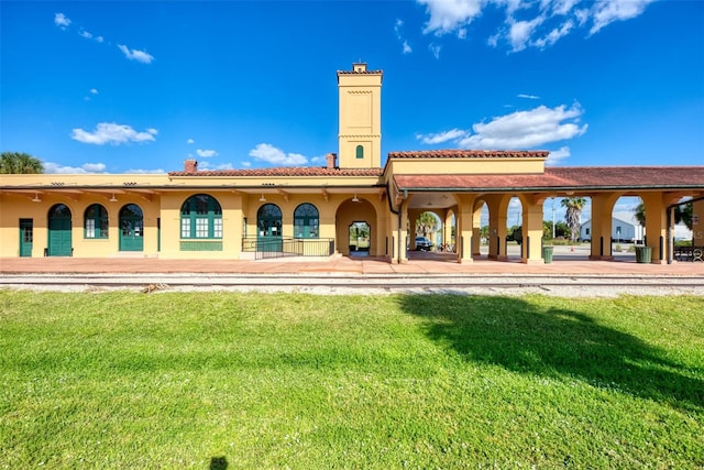 371 Capulet Dr, Venice, FL 34292 - rear view of property with a yard, a chimney, and stucco siding