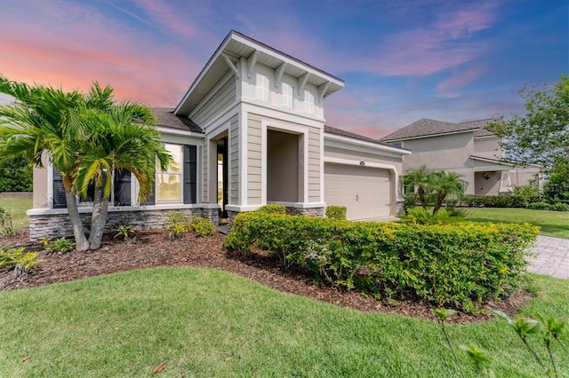 11240 Spring Gate Trl, Bradenton, FL 34211 - view of front facade with a garage, a yard, and stone siding