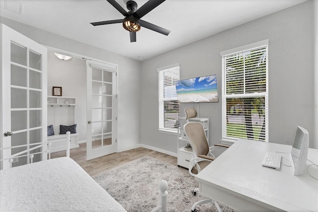 11240 Spring Gate Trl, Bradenton, FL 34211 - office area featuring french doors, a ceiling fan, and wood finished floors