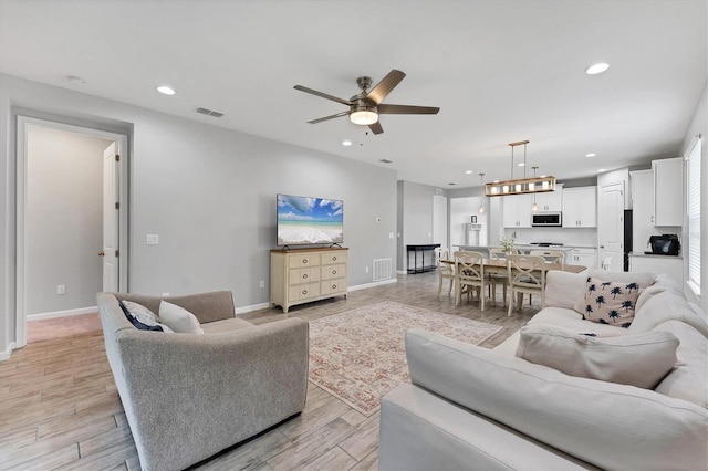 11240 Spring Gate Trl, Bradenton, FL 34211 - living area with recessed lighting, ceiling fan, and light wood-style floors