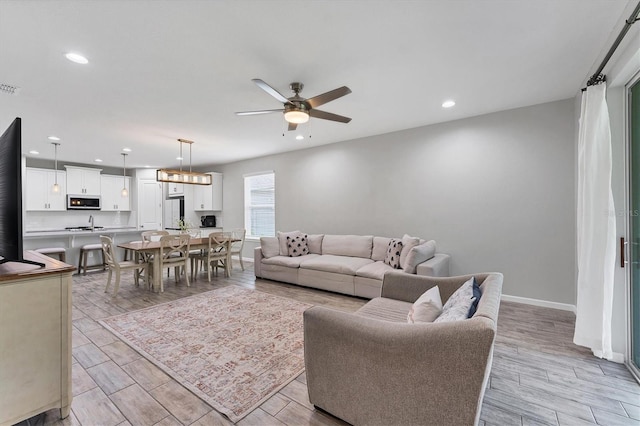 11240 Spring Gate Trl, Bradenton, FL 34211 - living room featuring ceiling fan, recessed lighting, and light wood finished floors