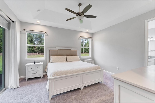 11240 Spring Gate Trl, Bradenton, FL 34211 - bedroom featuring multiple windows, light colored carpet, recessed lighting, a ceiling fan, and ensuite bathroom