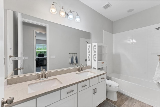 11240 Spring Gate Trl, Bradenton, FL 34211 - bathroom with double vanity, bathtub / shower combination, and wood finished floors