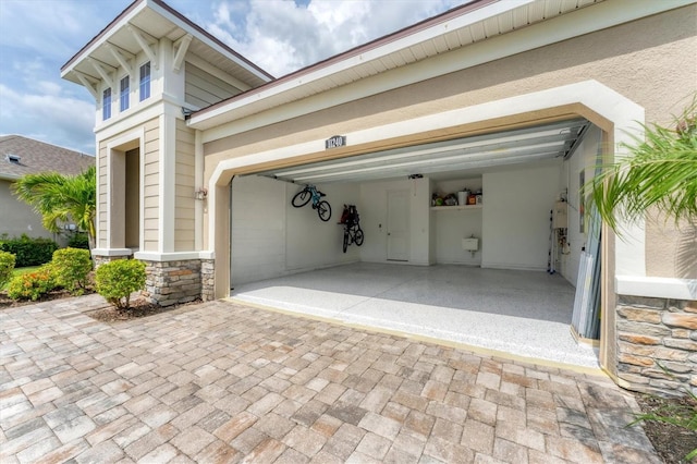 11240 Spring Gate Trl, Bradenton, FL 34211 - garage featuring decorative driveway