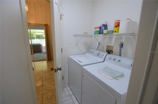 505 Duke Rd, Venice, FL 34293 - washroom featuring washing machine and clothes dryer and light tile patterned flooring