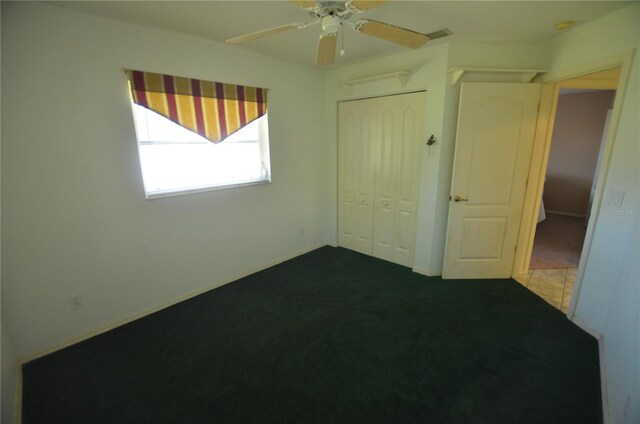 505 Duke Rd, Venice, FL 34293 - unfurnished bedroom featuring a closet, carpet floors, and a ceiling fan