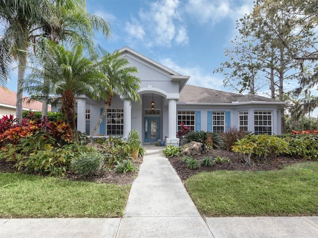 819 Shadow Bay Way, Osprey, FL 34229 - view of front facade with stucco siding and a front lawn