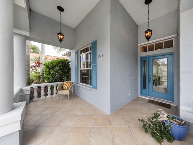 819 Shadow Bay Way, Osprey, FL 34229 - property entrance featuring covered porch and stucco siding