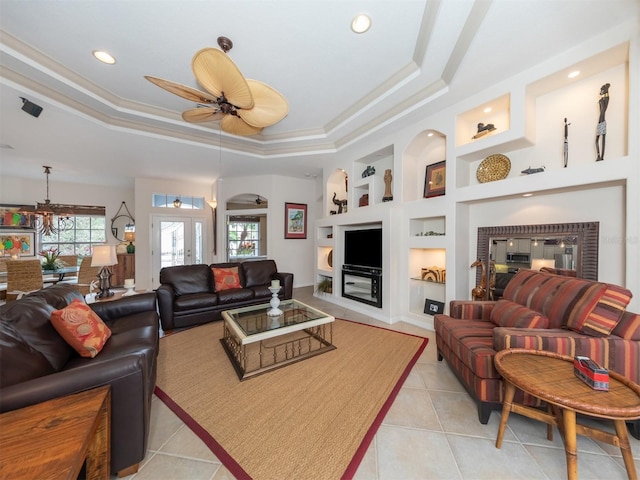 819 Shadow Bay Way, Osprey, FL 34229 - living area with a tray ceiling, plenty of natural light, built in features, and recessed lighting