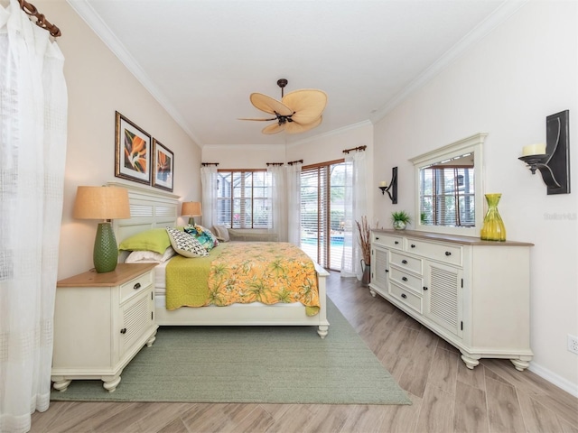 819 Shadow Bay Way, Osprey, FL 34229 - bedroom with access to outside, ornamental molding, light wood-style floors, and a ceiling fan