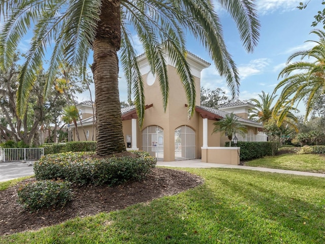 819 Shadow Bay Way, Osprey, FL 34229 - view of side of property with stucco siding and a tile roof