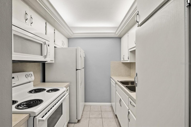 614 Guild Dr Unit 10, Venice, FL 34285 - kitchen with white appliances, light countertops, white cabinets, and light tile patterned floors