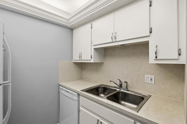 614 Guild Dr Unit 10, Venice, FL 34285 - kitchen with dishwasher, light countertops, backsplash, white cabinets, and refrigerator