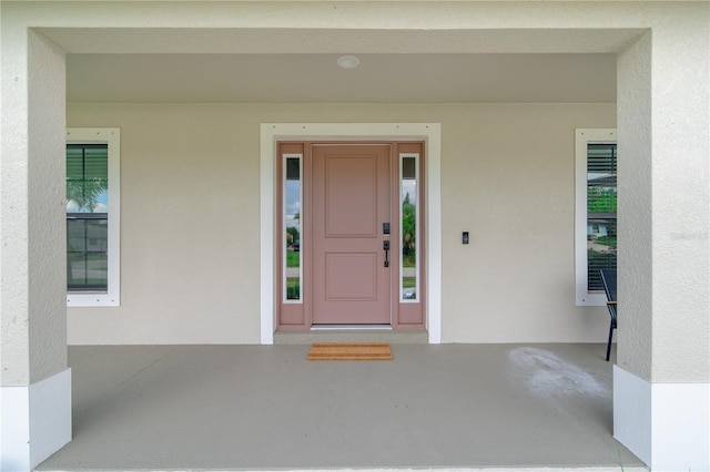 7257 Maguire Ln, Englewood, FL 34224 - property entrance featuring stucco siding