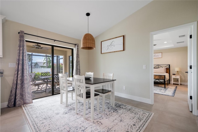7257 Maguire Ln, Englewood, FL 34224 - tiled dining area with baseboards and vaulted ceiling