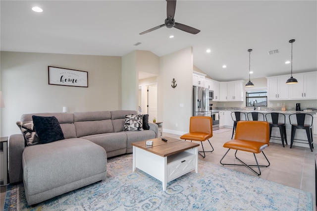 7257 Maguire Ln, Englewood, FL 34224 - living room featuring ceiling fan, vaulted ceiling, and recessed lighting
