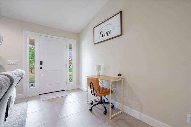 7257 Maguire Ln, Englewood, FL 34224 - foyer with baseboards and light tile patterned floors