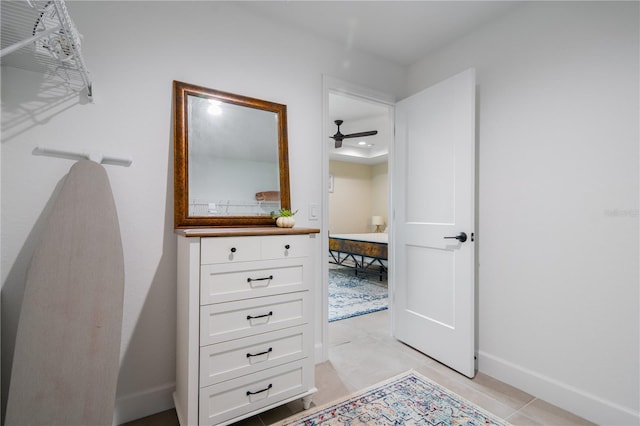 7257 Maguire Ln, Englewood, FL 34224 - spacious closet with light tile patterned flooring and ceiling fan