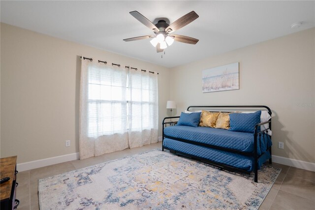 7257 Maguire Ln, Englewood, FL 34224 - sitting room with tile patterned floors and ceiling fan