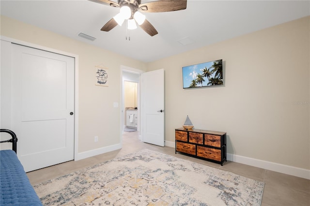 7257 Maguire Ln, Englewood, FL 34224 - bedroom with tile patterned floors, ceiling fan, and a closet