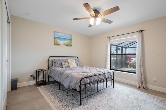 7257 Maguire Ln, Englewood, FL 34224 - bedroom featuring light tile patterned floors and ceiling fan