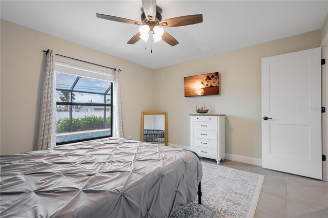 7257 Maguire Ln, Englewood, FL 34224 - bedroom featuring light tile patterned floors and ceiling fan
