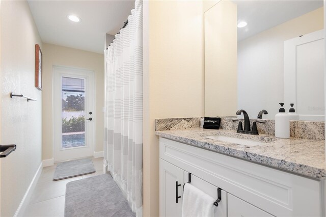 7257 Maguire Ln, Englewood, FL 34224 - bathroom featuring vanity, tile patterned flooring, and recessed lighting