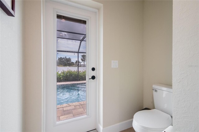 7257 Maguire Ln, Englewood, FL 34224 - bathroom featuring toilet and a water view