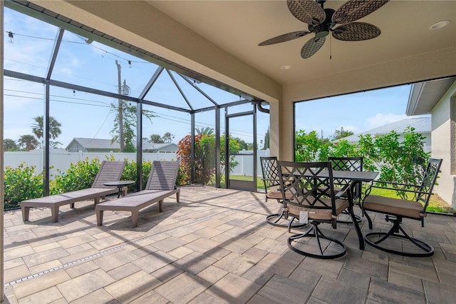 7257 Maguire Ln, Englewood, FL 34224 - view of patio / terrace with ceiling fan, a lanai, and outdoor dining area