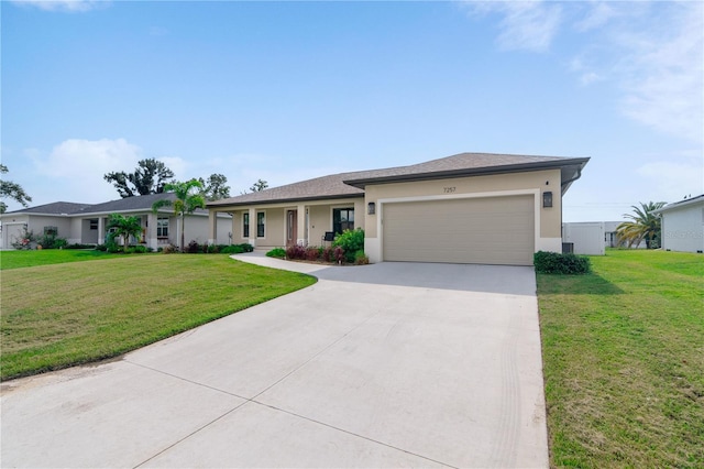 7257 Maguire Ln, Englewood, FL 34224 - ranch-style home featuring a garage, concrete driveway, a front lawn, and stucco siding
