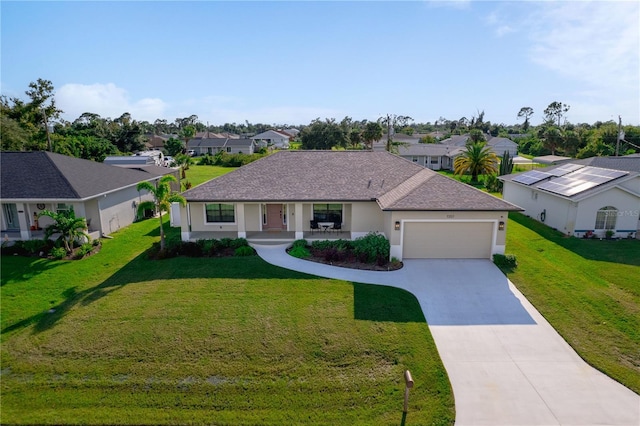 7257 Maguire Ln, Englewood, FL 34224 - single story home with a residential view, an attached garage, driveway, a porch, and a front lawn