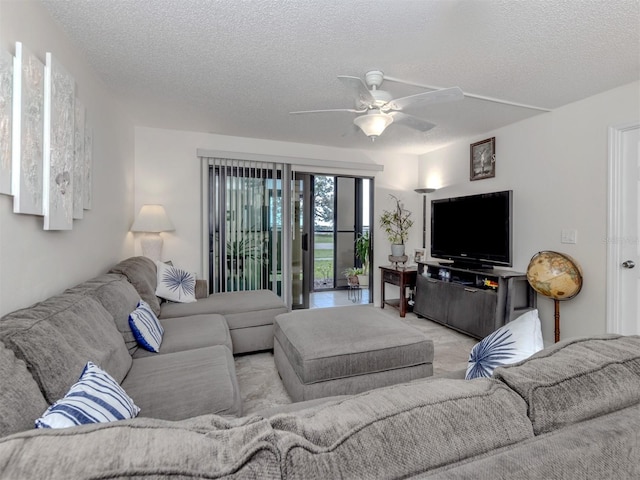 401 Airport Ave E Unit 304, Venice, FL 34285 - living room featuring a textured ceiling and a ceiling fan