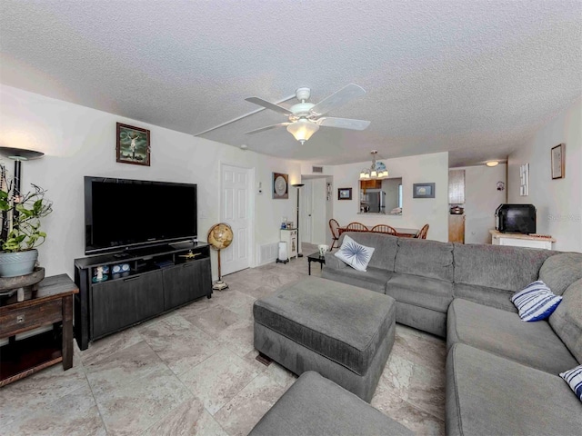 401 Airport Ave E Unit 304, Venice, FL 34285 - living room featuring ceiling fan and a textured ceiling
