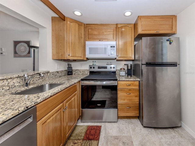 401 Airport Ave E Unit 304, Venice, FL 34285 - kitchen featuring stainless steel appliances, light stone countertops, and recessed lighting