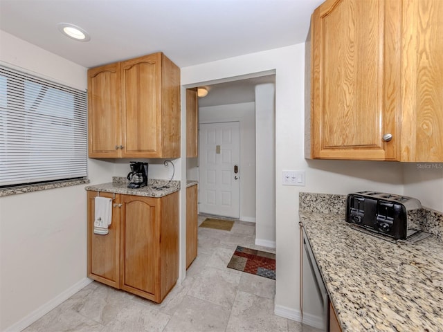 401 Airport Ave E Unit 304, Venice, FL 34285 - kitchen with light stone countertops and dishwasher